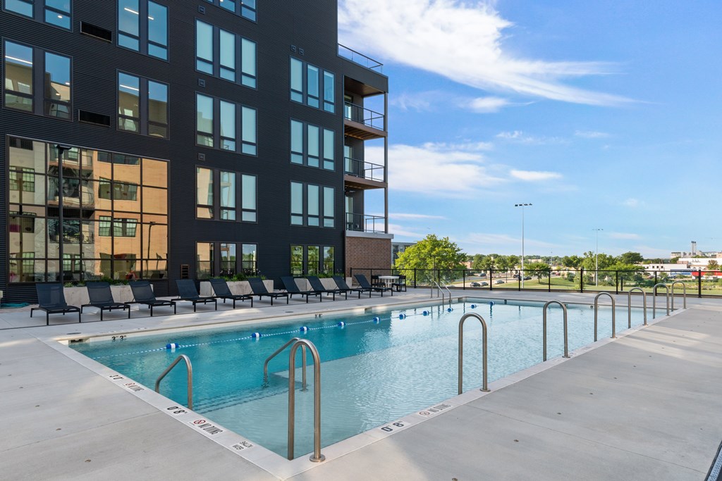 a swimming pool in front of a building